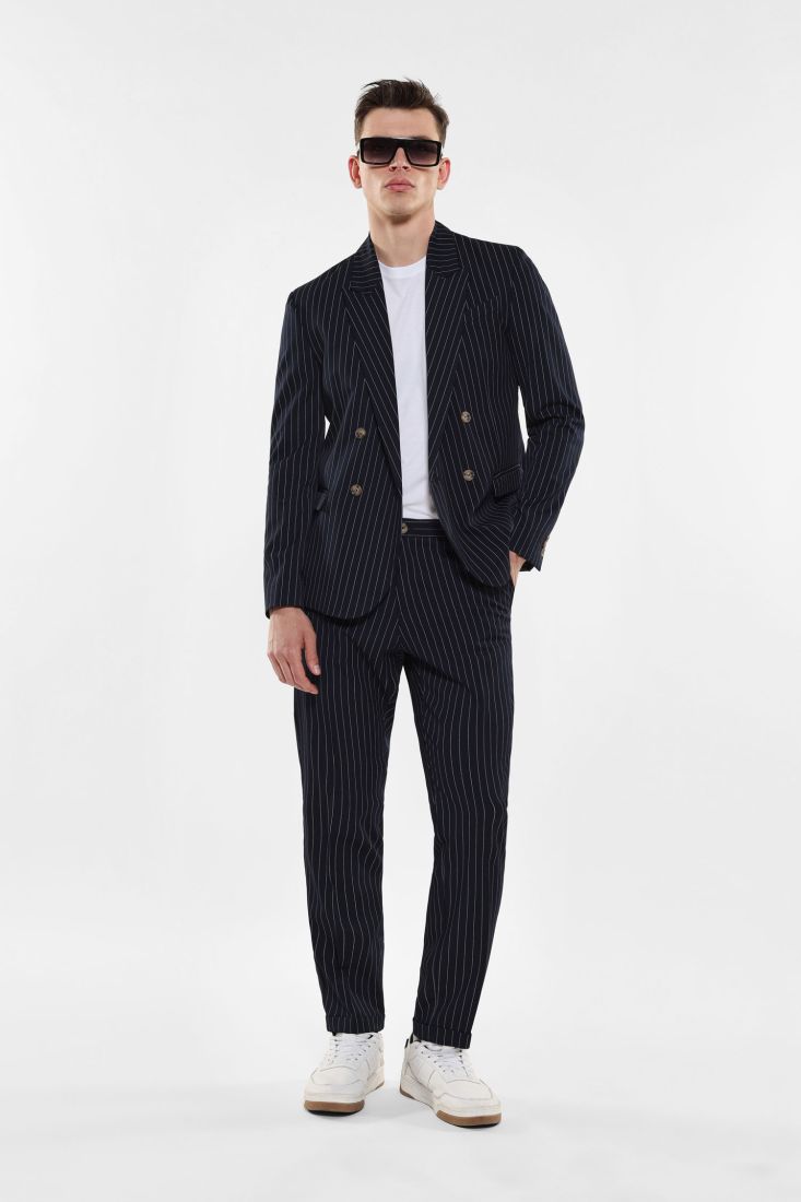 Pantaloni slim-fit fantasia gessata con tasche verticali